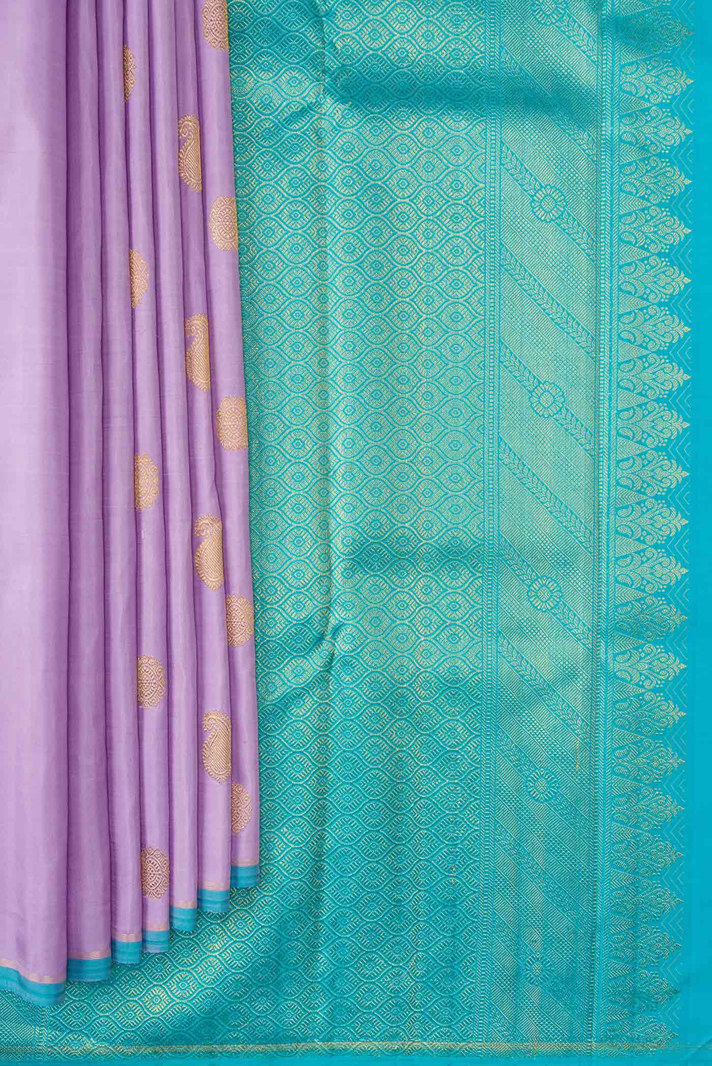 Pleats and pallu of Pure Silk Pure Zari Lavender Dual Tone Kanchipuram Saree with Zari Butta on the body and Thin Zari Line. 