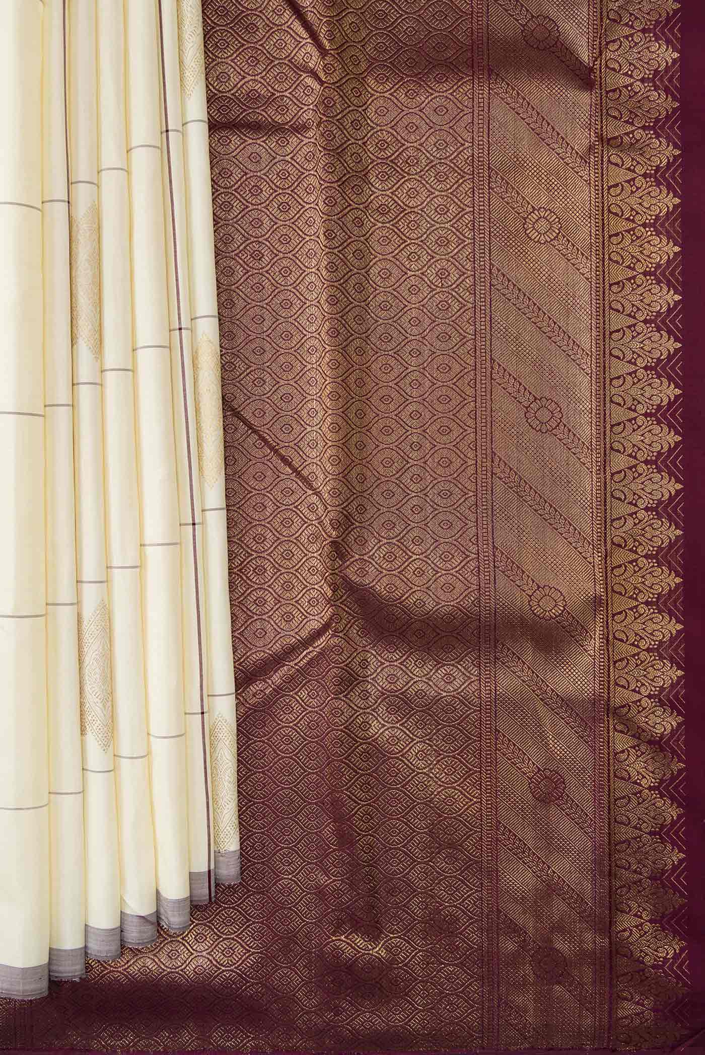 Pleats and pallu of Pure Silk Pure Zari Off White Dual Tone Kanjivaram Saree with Checked design on the body and Without Border. 