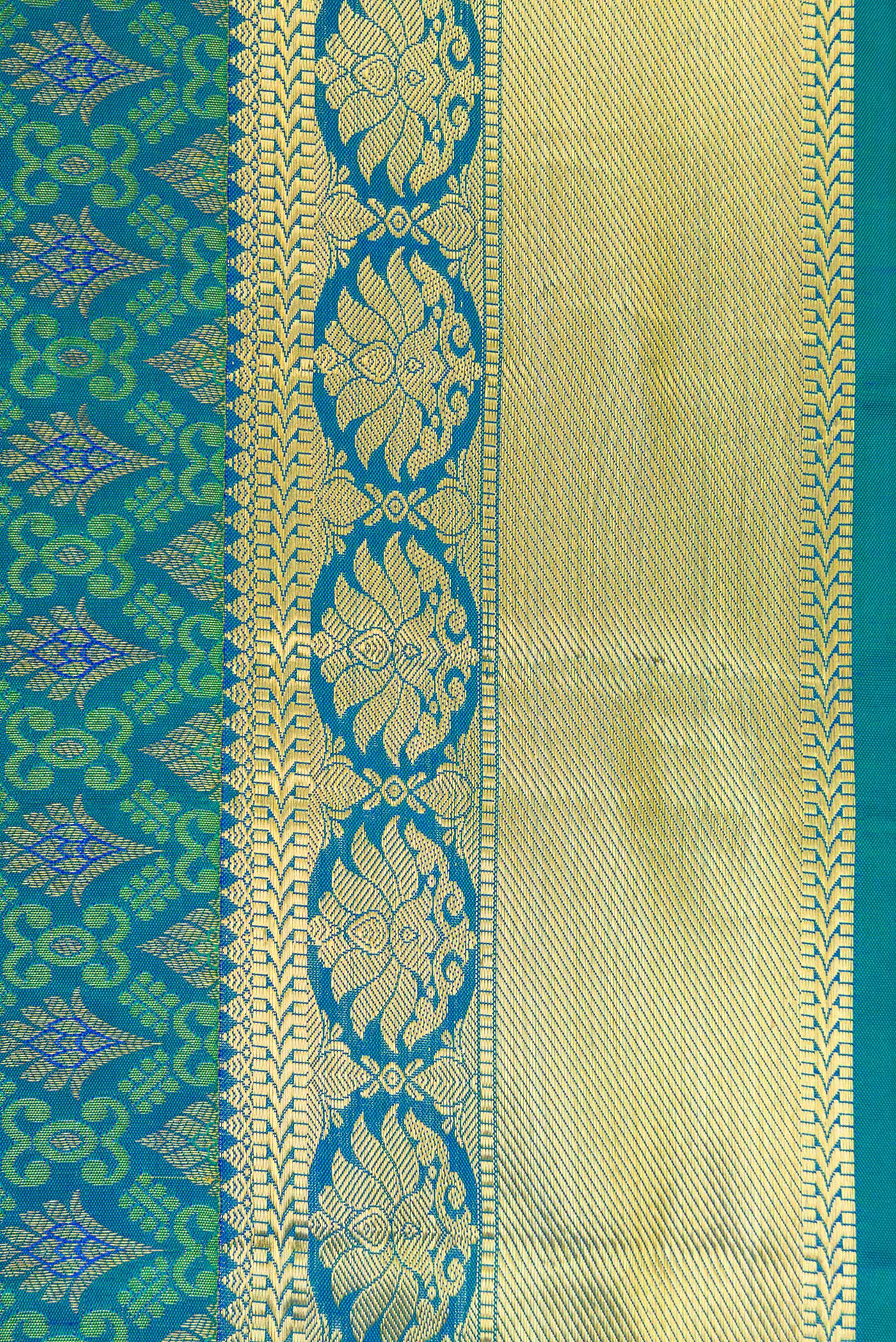 Border image of Peacock Blue Dual Tone Kanjivaram Silk Saree with Zari Brocade on the body and Zari Border. 