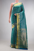 Peacock Blue Dual Tone Kanjivaram Silk Saree with Zari Brocade on the body and Zari Border.  displayed on a mannequin