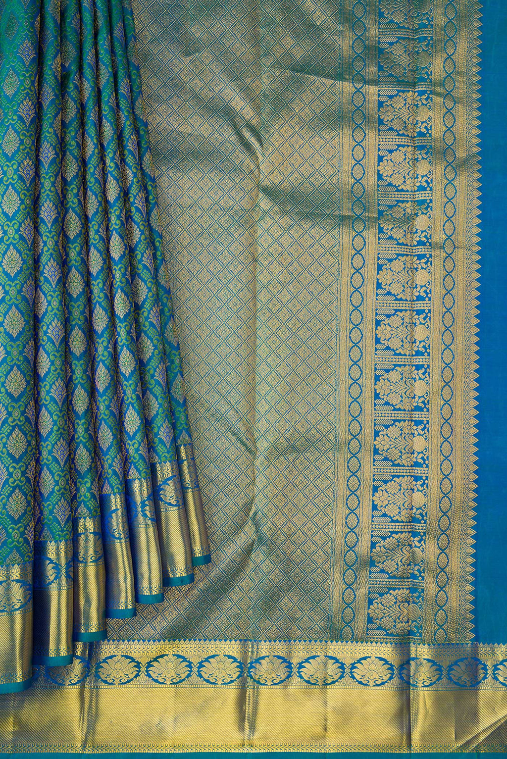 Pleats and pallu of Peacock Blue Dual Tone Kanjivaram Silk Saree with Zari Brocade on the body and Zari Border. 