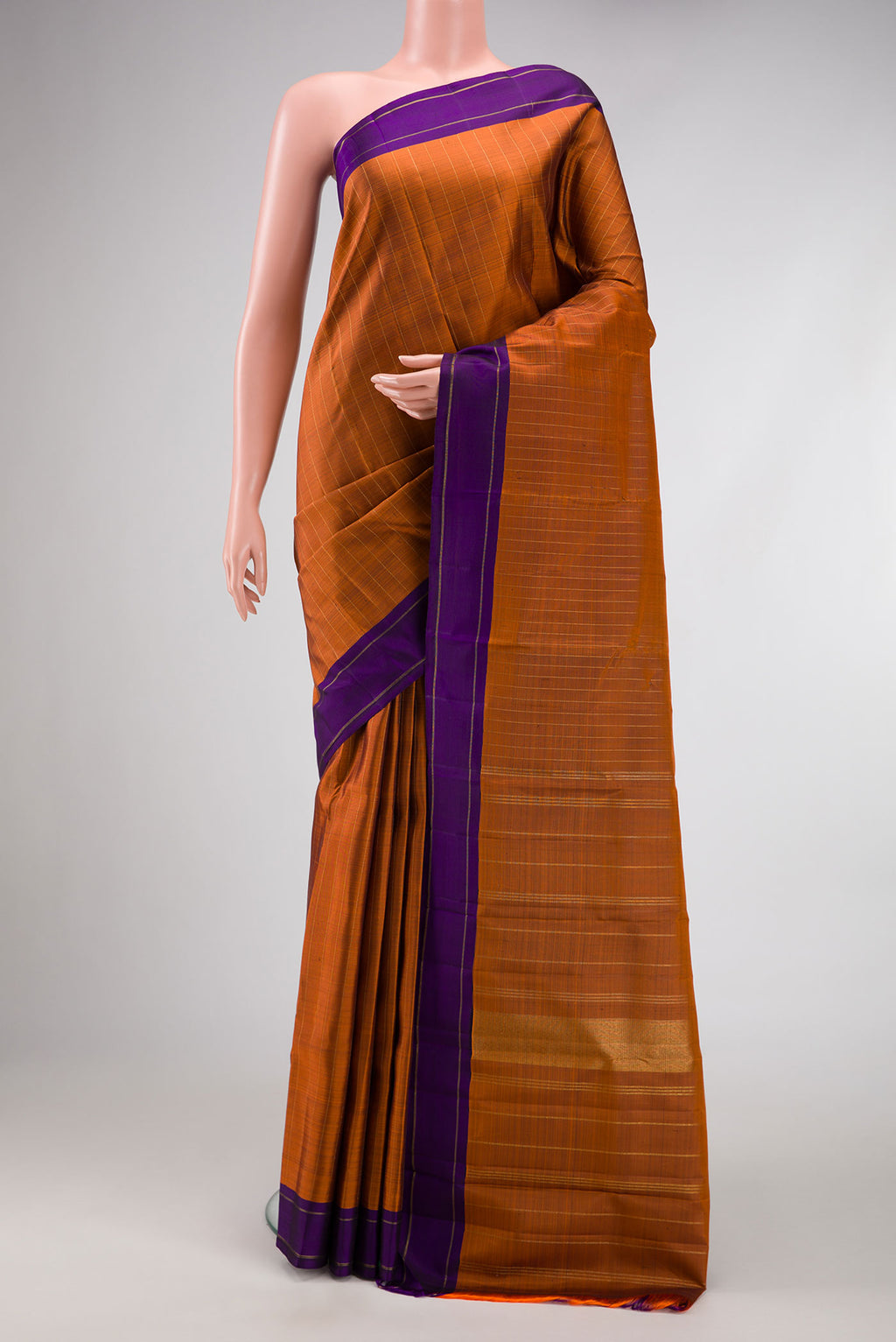 Orange Dual Tone Kanjivaram Silk Saree with Stripes on the body and Zari Border.  displayed on a mannequin