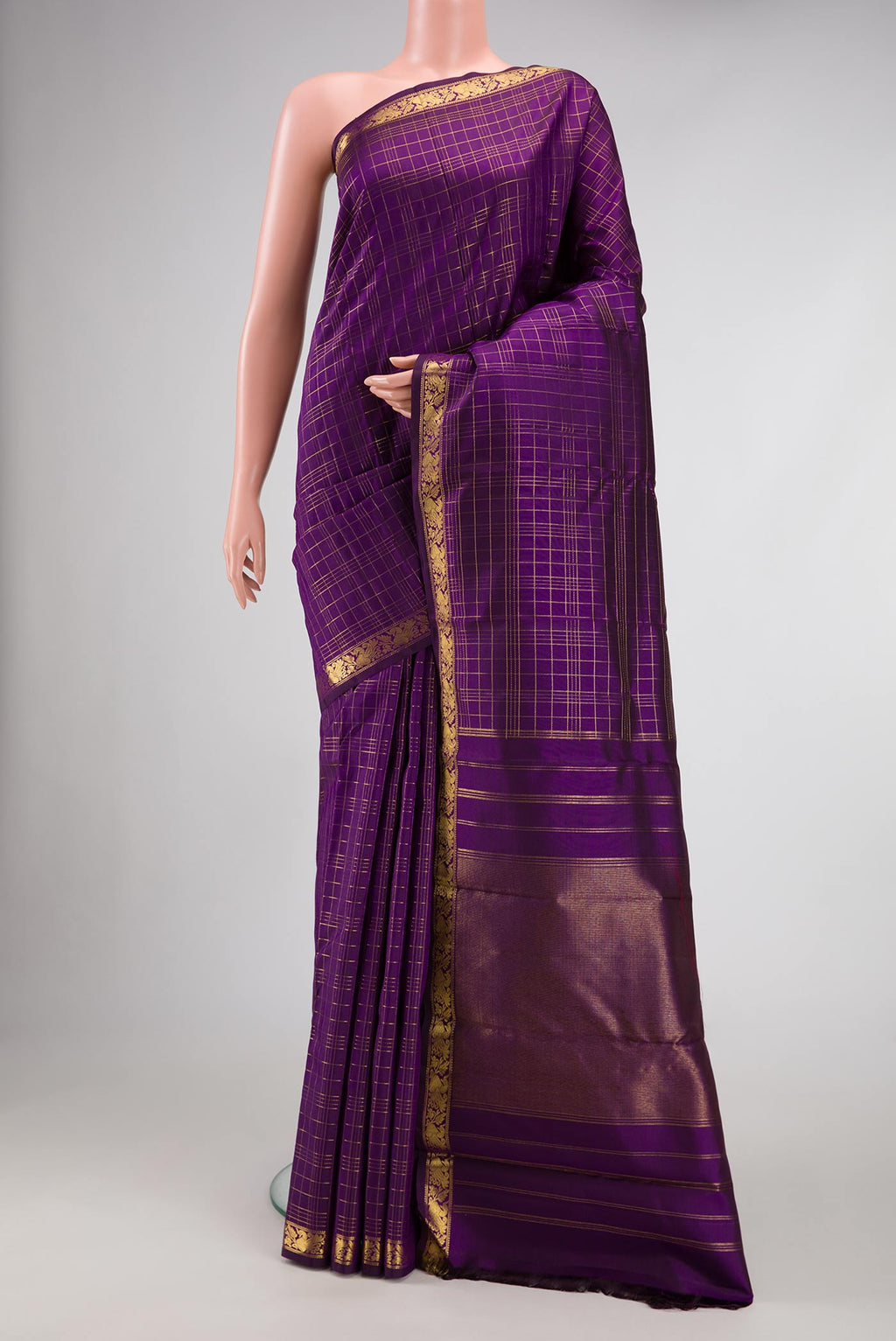 Pure Silk Pure Zari Violet Dual Tone Kanchipuram Saree with Checked design on the body and Zari Border.  displayed on a mannequin