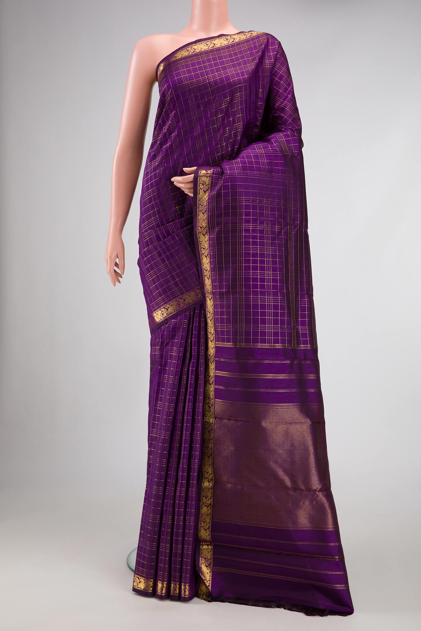 Pure Silk Pure Zari Violet Dual Tone Kanchipuram Saree with Checked design on the body and Zari Border.  displayed on a mannequin