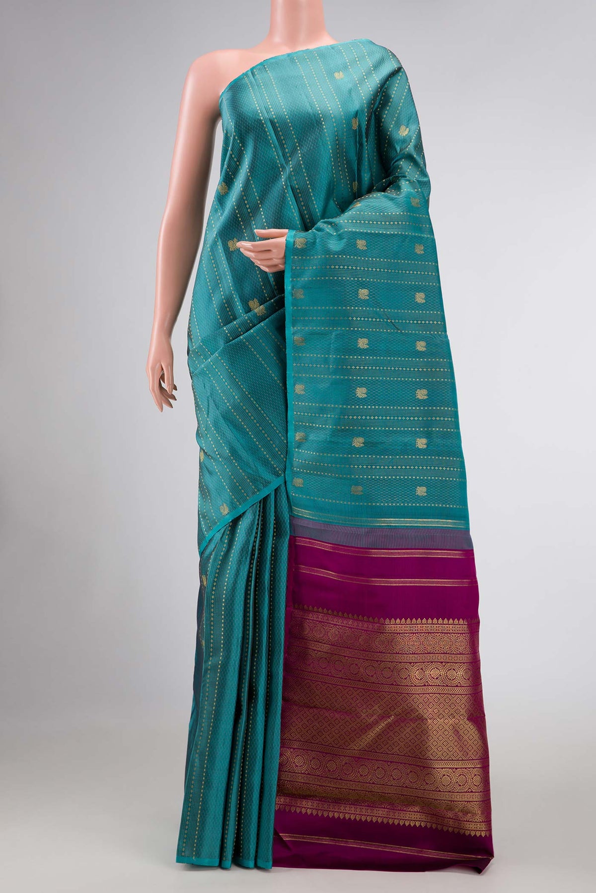 Maya Blue Dual Tone Kanchipuram Silk Saree with Zari Butta on the body and Zari Border displayed on a mannequin