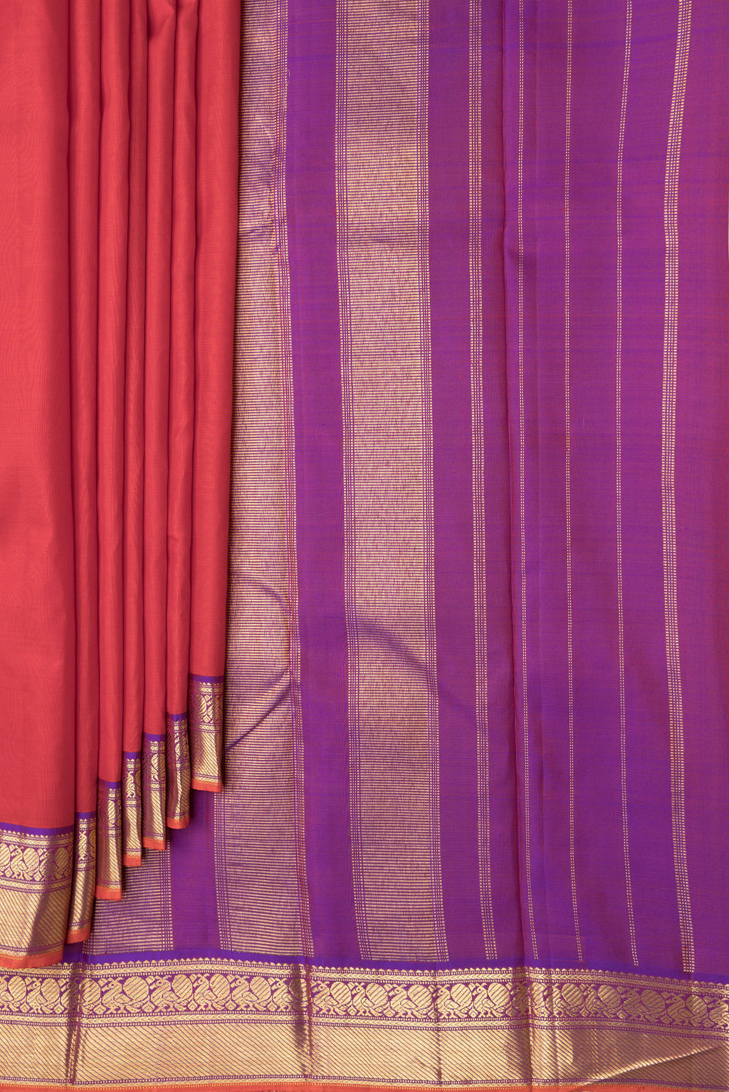 Pleats and pallu of Red Dual Tone Kanchipuram Silk Saree with Plain Body and Zari Border. 