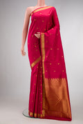 Maroon Dual Tone Kanchipuram Silk Saree with Zari Butta on the body and Zari Border.  displayed on a mannequin