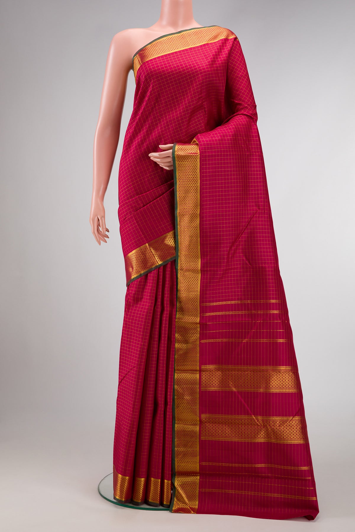 Maroon Dual Tone Kanchipuram Silk Saree with Checked design on the body and Zari Border.  displayed on a mannequin