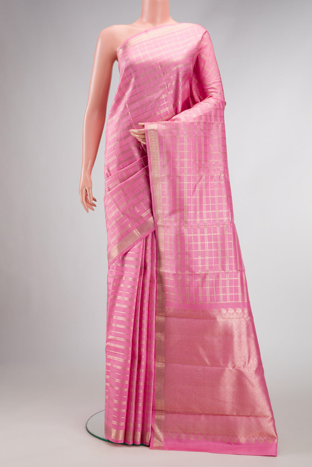 Pink Dual Tone Kanjivaram Silk Saree with Checked design on the body and Zari Border.  displayed on a mannequin