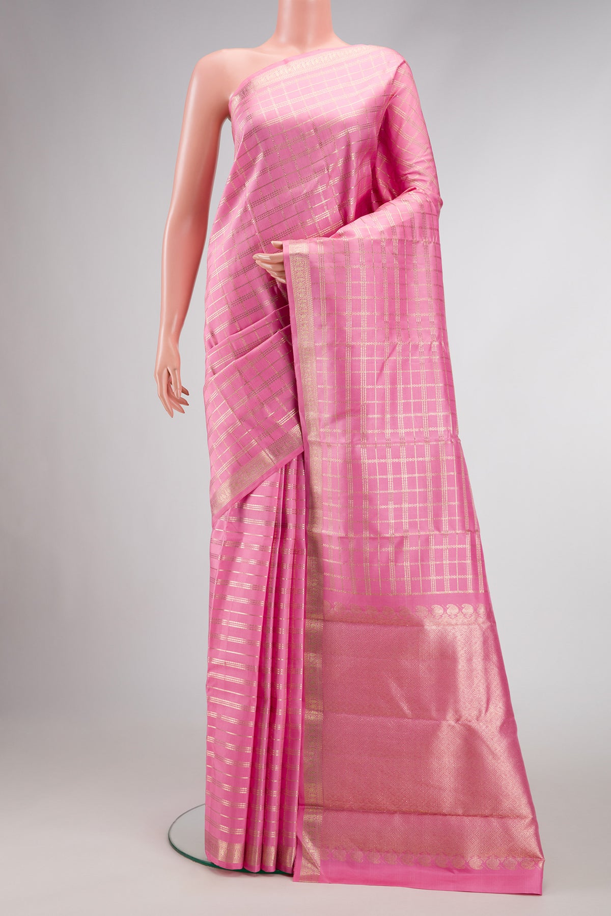 Pink Dual Tone Kanjivaram Silk Saree with Checked design on the body and Zari Border.  displayed on a mannequin