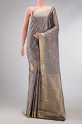 Grey Dual Tone Kanjivaram Silk Saree with Zari Butta on the body and Zari Border.  displayed on a mannequin