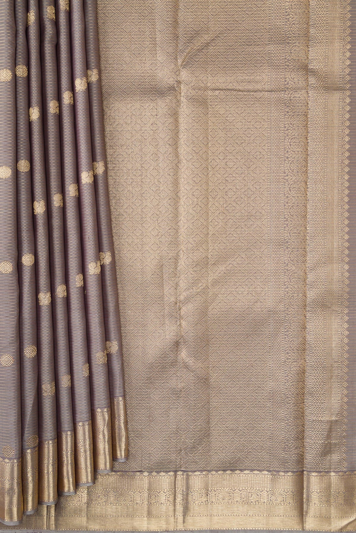 Pleats and pallu of Grey Dual Tone Kanjivaram Silk Saree with Zari Butta on the body and Zari Border. 