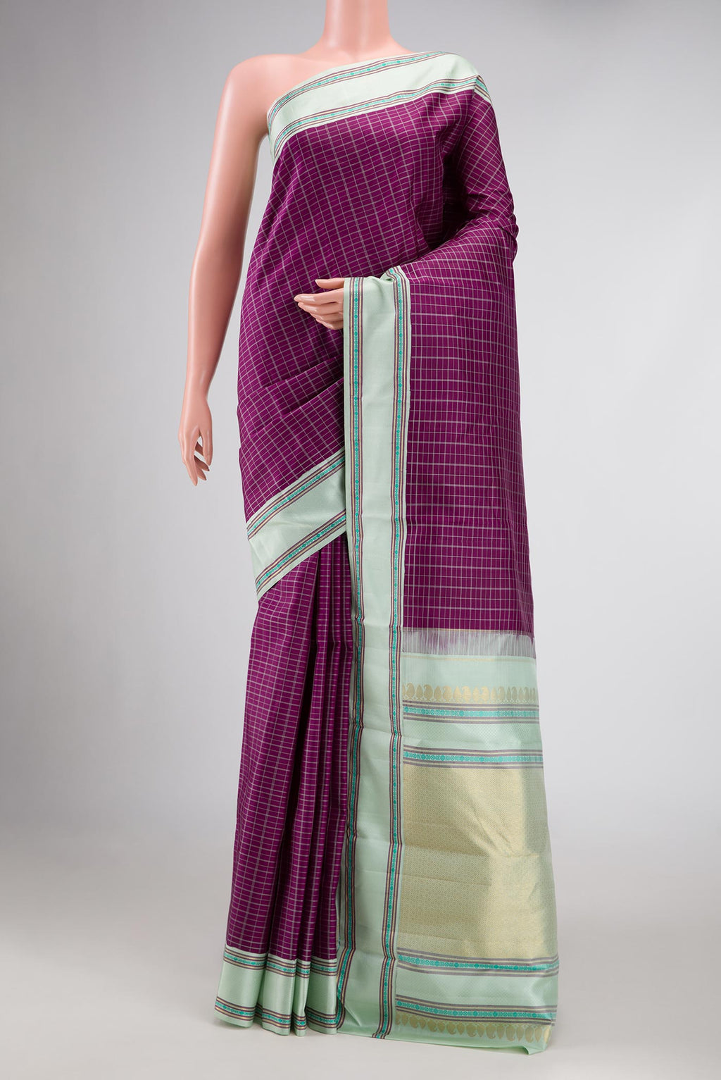 Pure Silk Pure Zari Purple Dual Tone Kanjivaram Saree with Checked design on the body and Zari And Thread Border.  displayed on a mannequin
