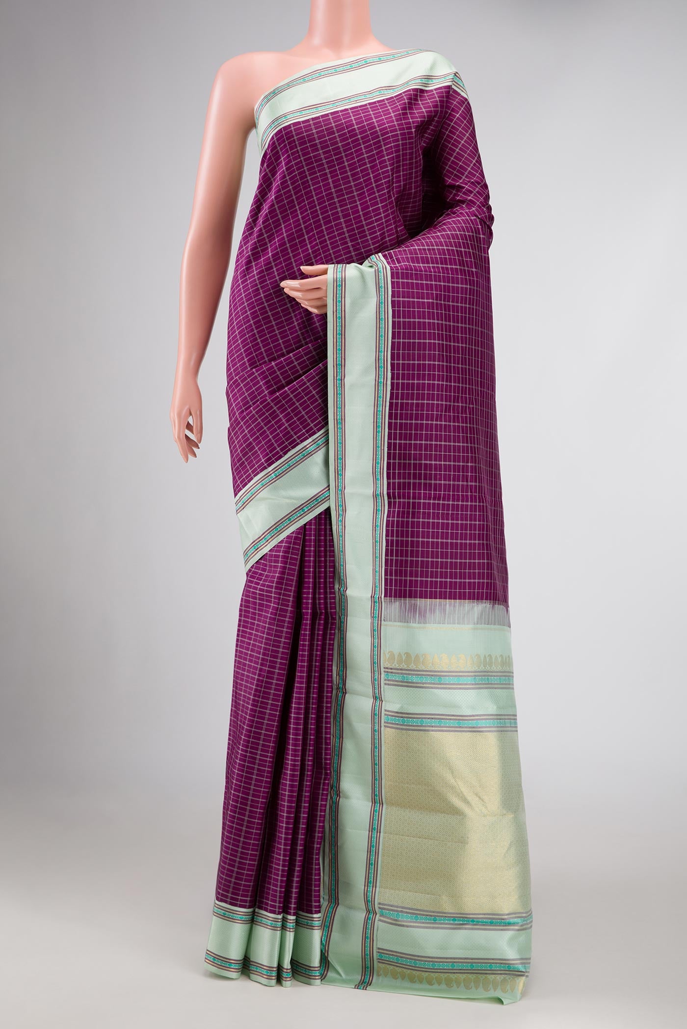 Pure Silk Pure Zari Purple Dual Tone Kanjivaram Saree with Checked design on the body and Zari And Thread Border.  displayed on a mannequin
