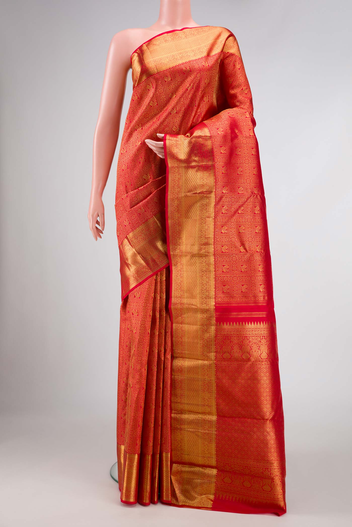 Pure Silk Pure Zari Red Dual Tone Kanchipuram Saree with Zari Brocade on the body and Zari Border displayed on a mannequin