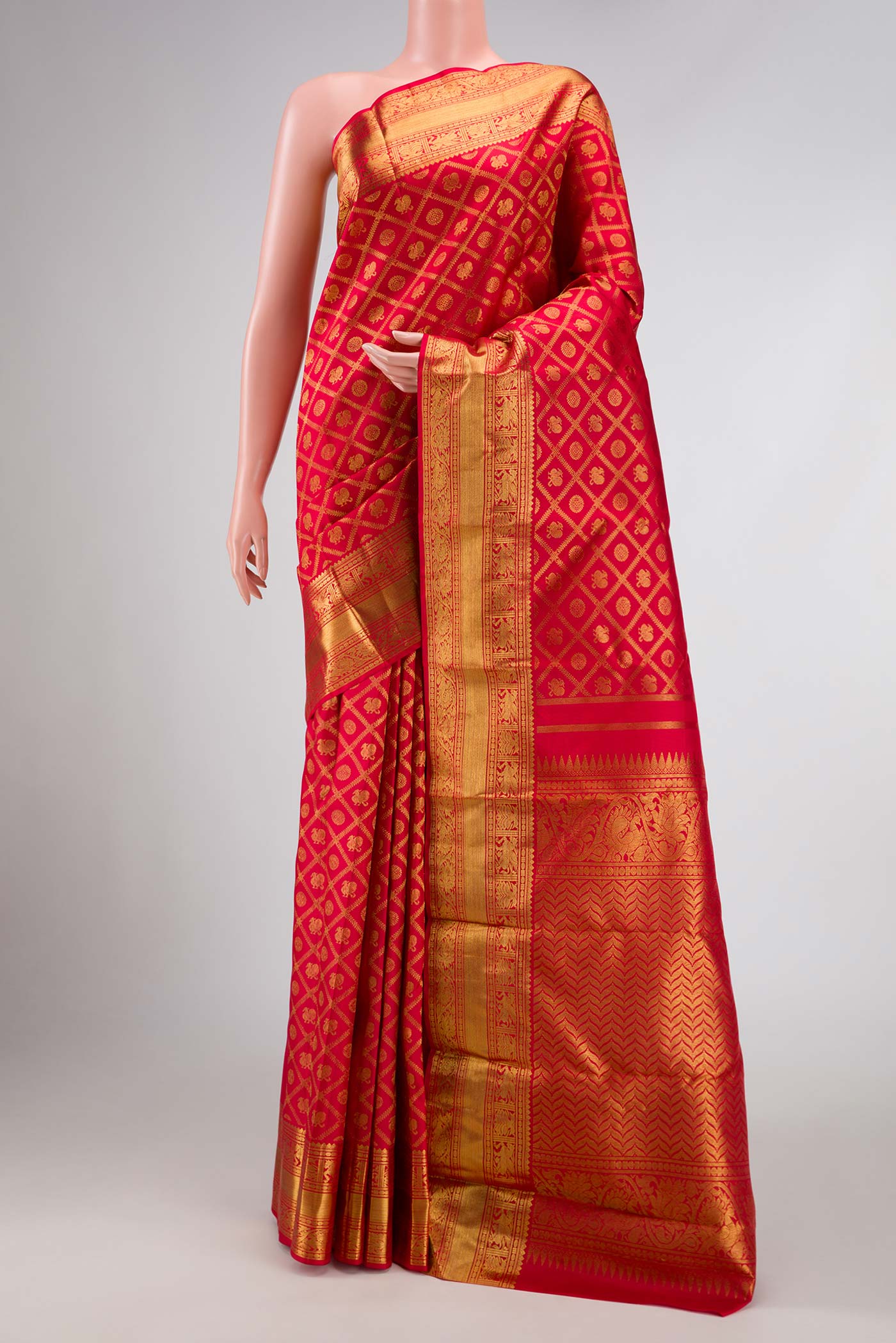 Pure Silk Pure Zari Red Dual Tone Kanchipuram Saree with Zari Brocade on the body and Zari Border displayed on a mannequin