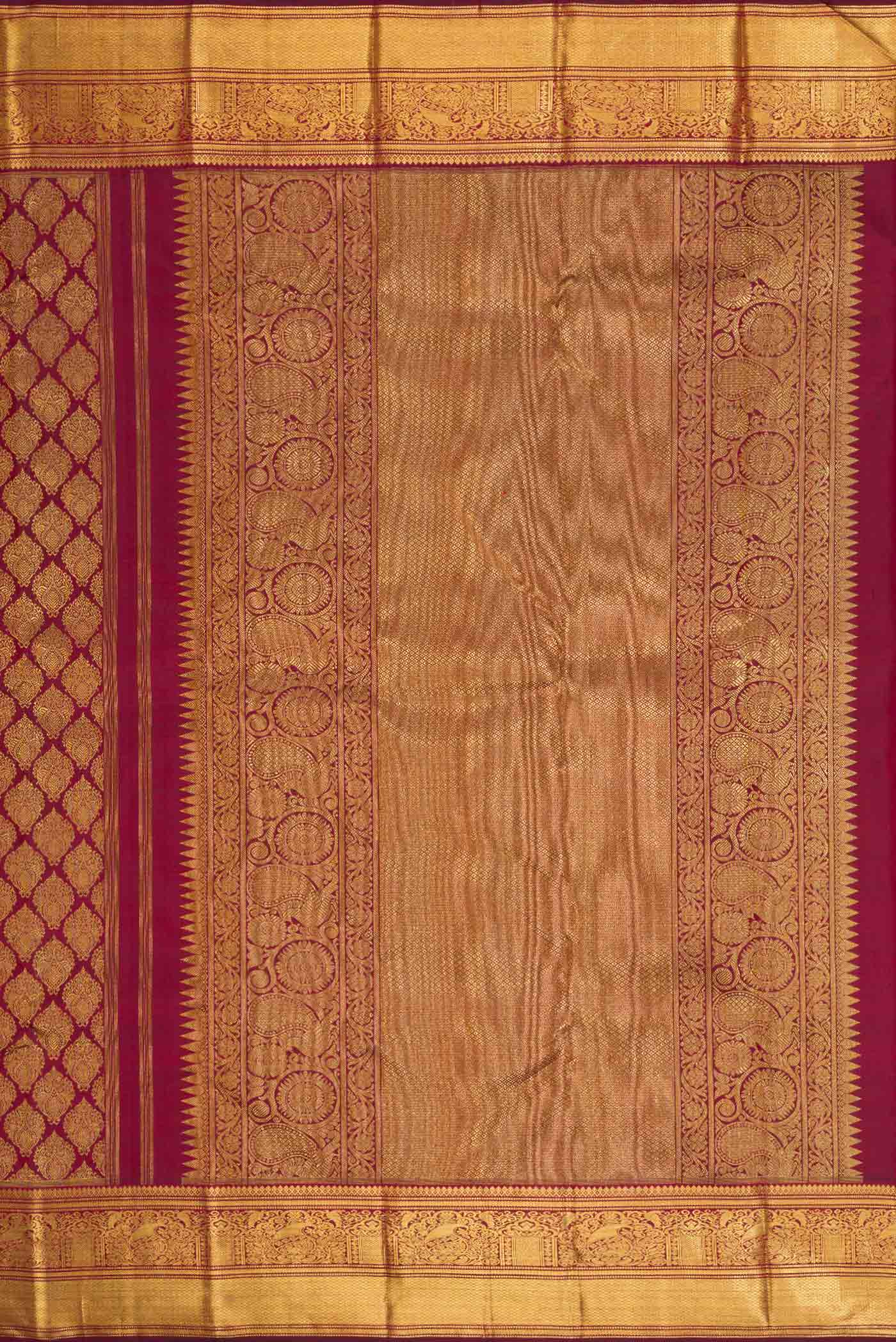 Close up image of the pallu of Pure Silk Pure Zari Maroon Dual Tone Kanchipuram Saree with Zari Brocade on the body and Zari Border