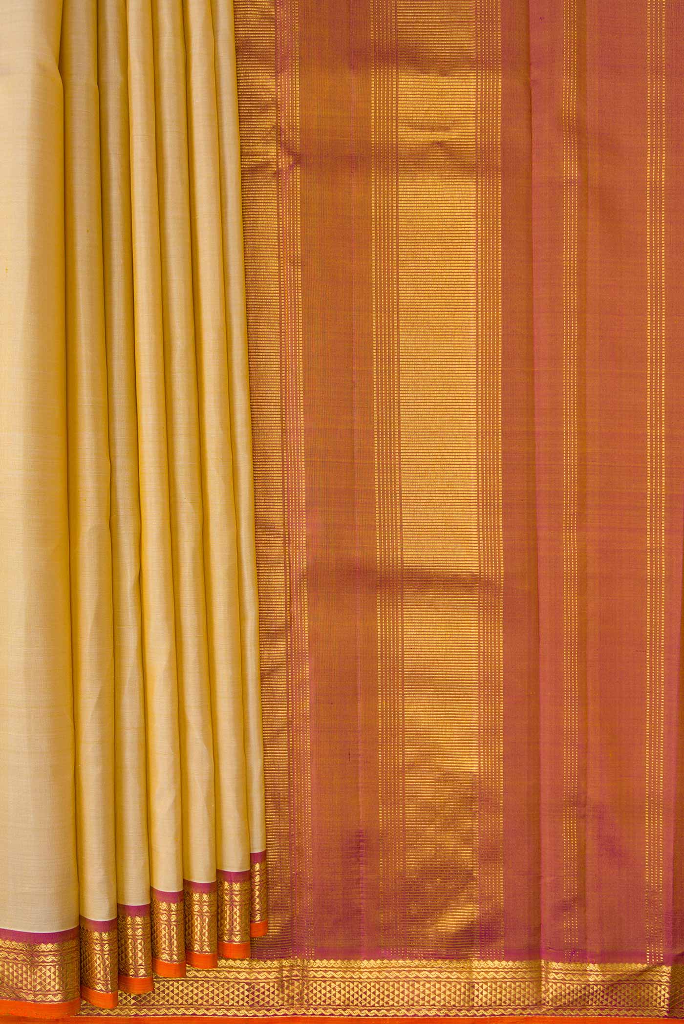 Pleats and pallu of Beige Dual Tone Kanjivaram Silk Saree with Plain Body and Thread Border. 