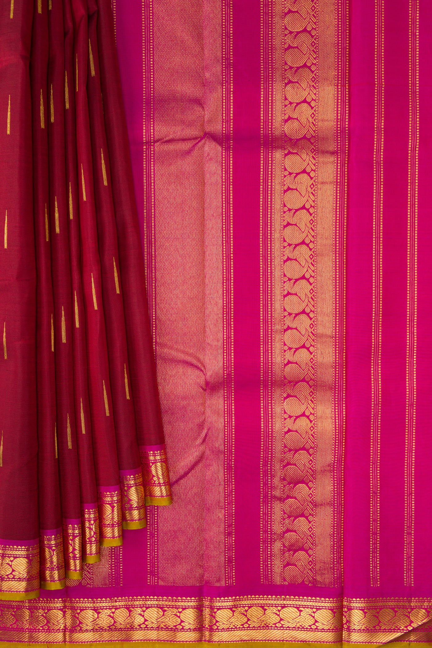 Pleats and pallu of Maroon Dual Tone Kanchipuram Silk Saree with Zari Butta on the body and Zari Border. 
