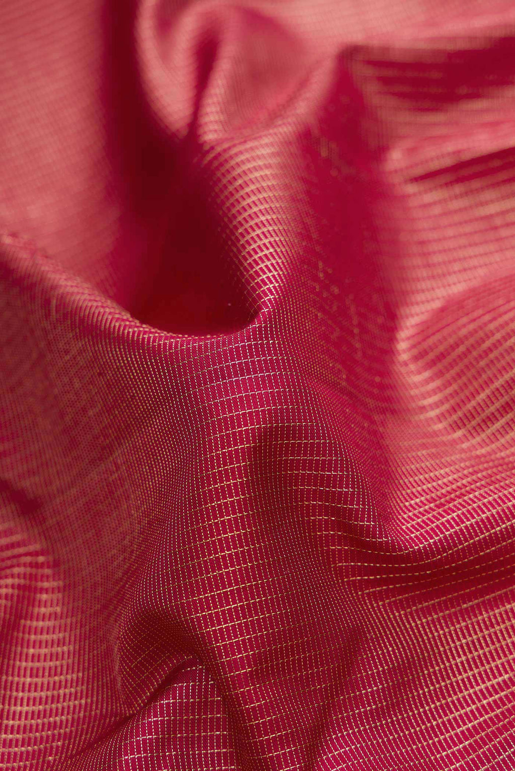 Close up of Maroon Dual Tone Kanjivaram Silk Saree with Stripes on the body and Fancy Border.  displaying folds