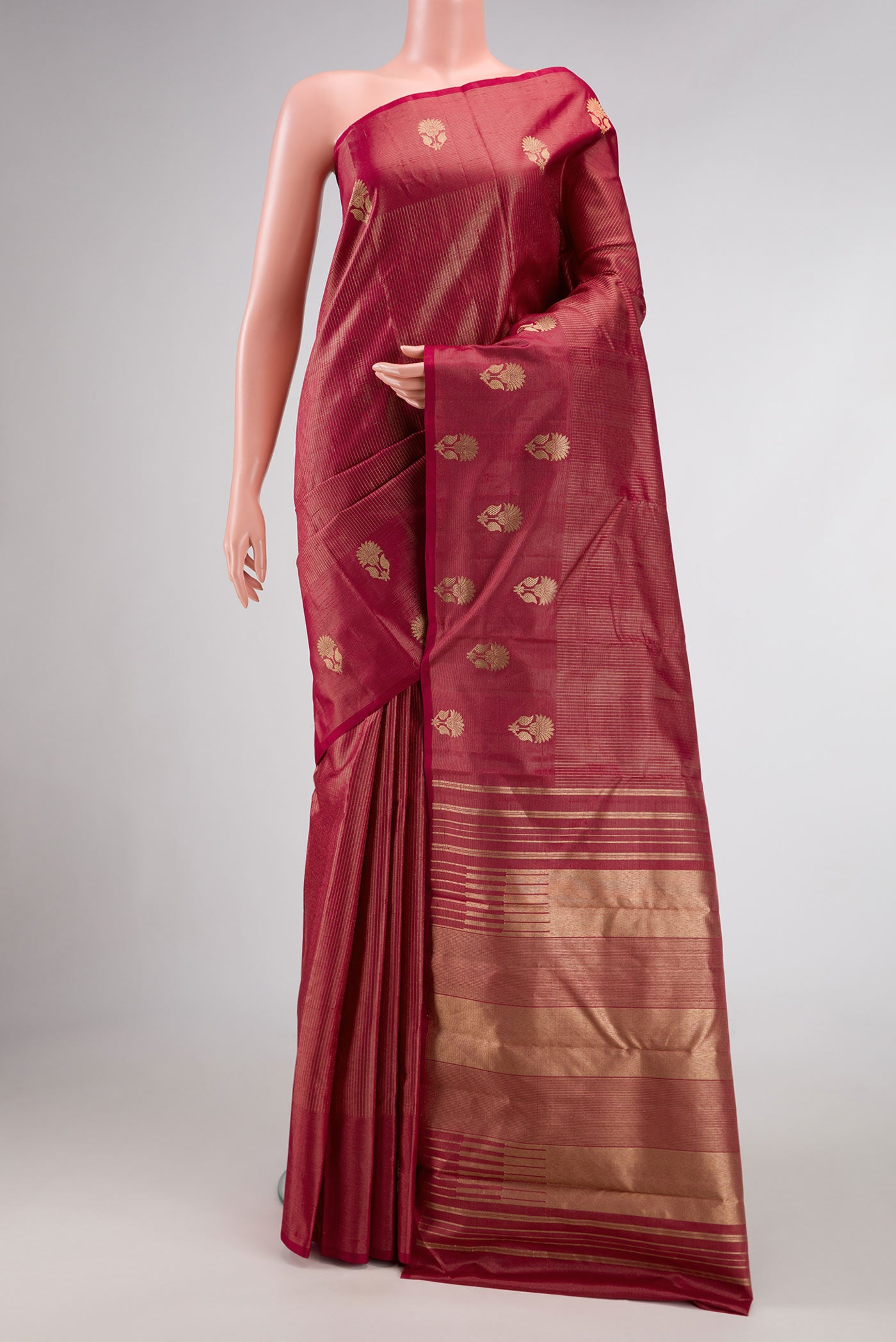 Maroon Dual Tone Kanjivaram Silk Saree with Stripes on the body and Fancy Border.  displayed on a mannequin