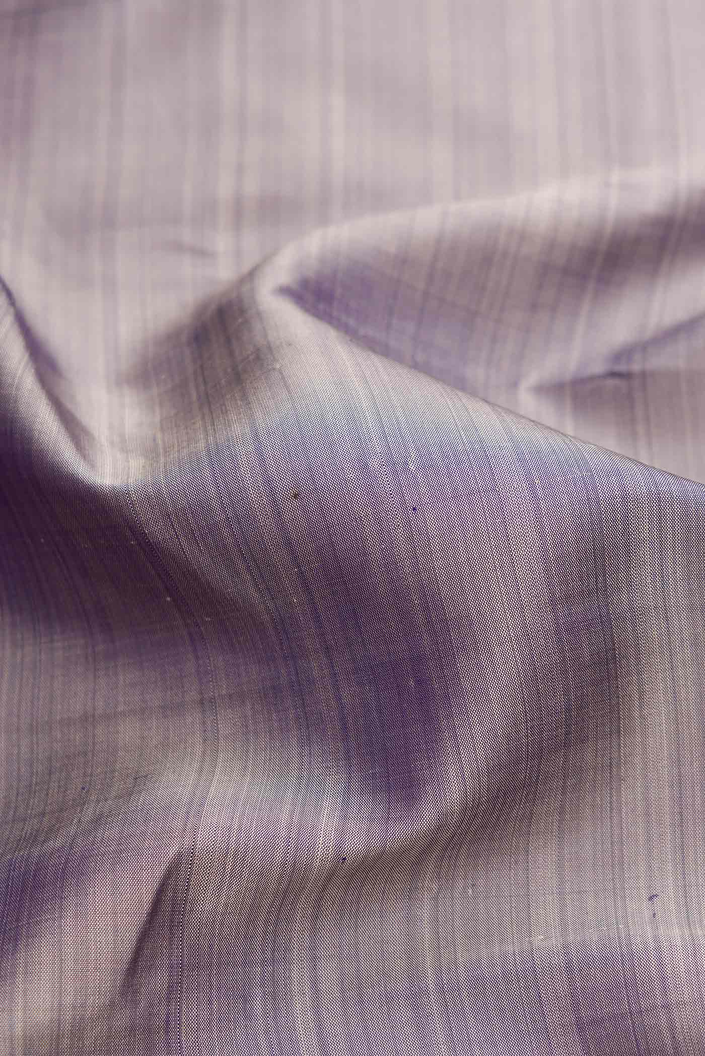 Close up of Grey Dual Tone Kanchipuram Silk Saree with Plain Body and Temple Border.  displaying folds