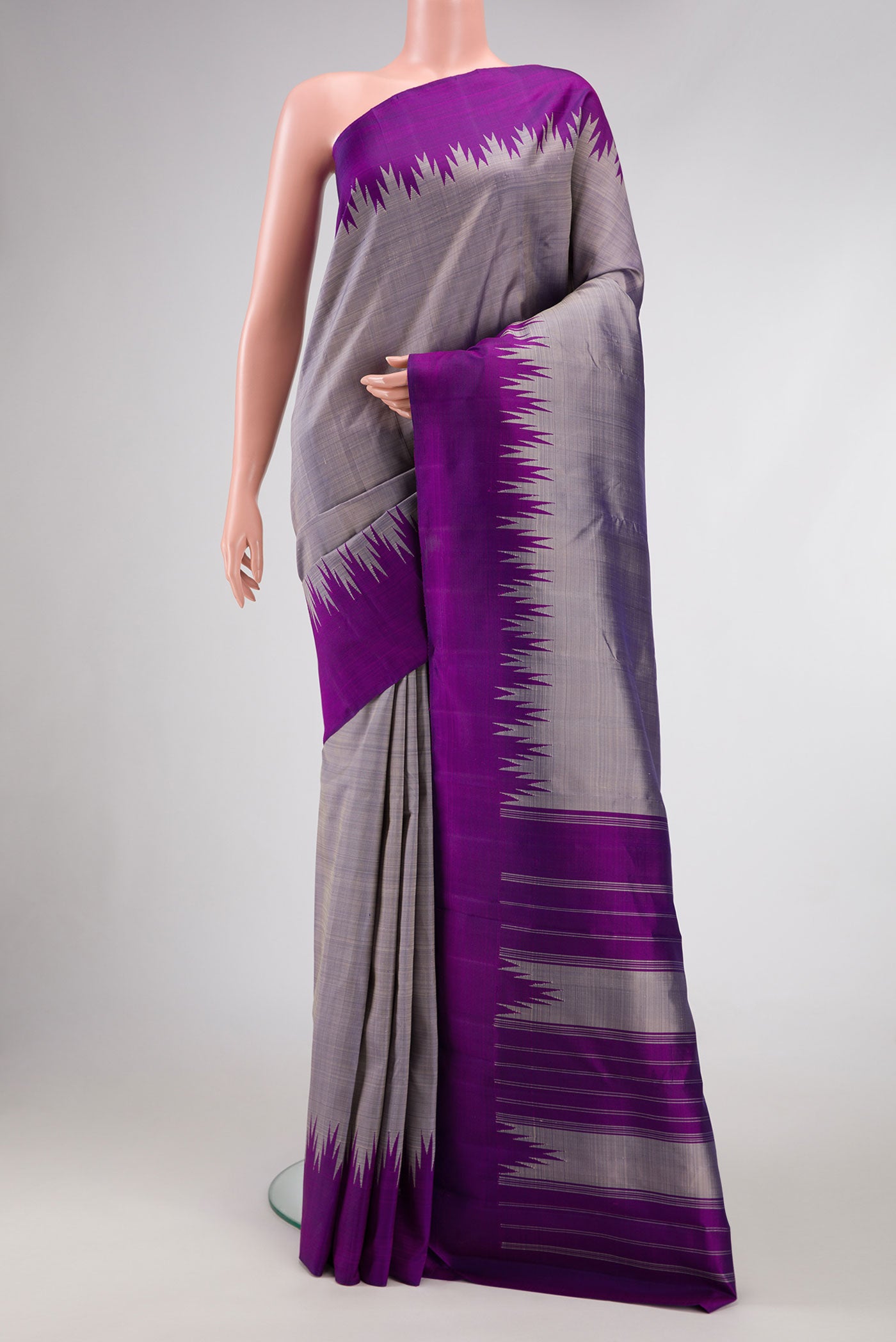 Grey Dual Tone Kanchipuram Silk Saree with Plain Body and Temple Border.  displayed on a mannequin