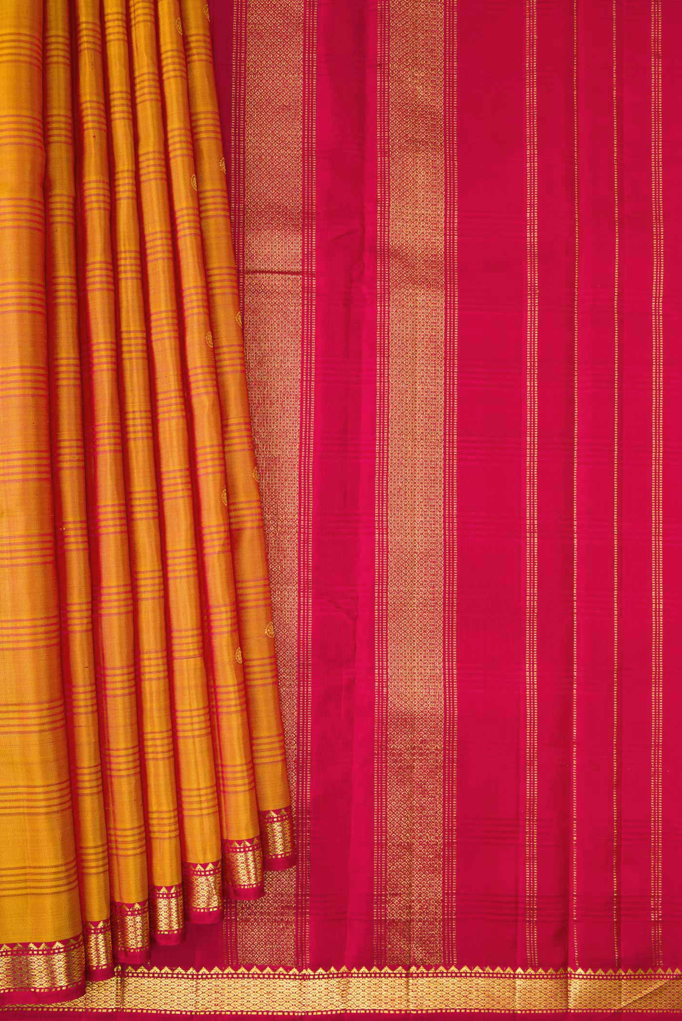 Pleats and pallu of Mustard Dual Tone Kanchipuram Silk Saree with Zari Butta on the body and Zari Border. 