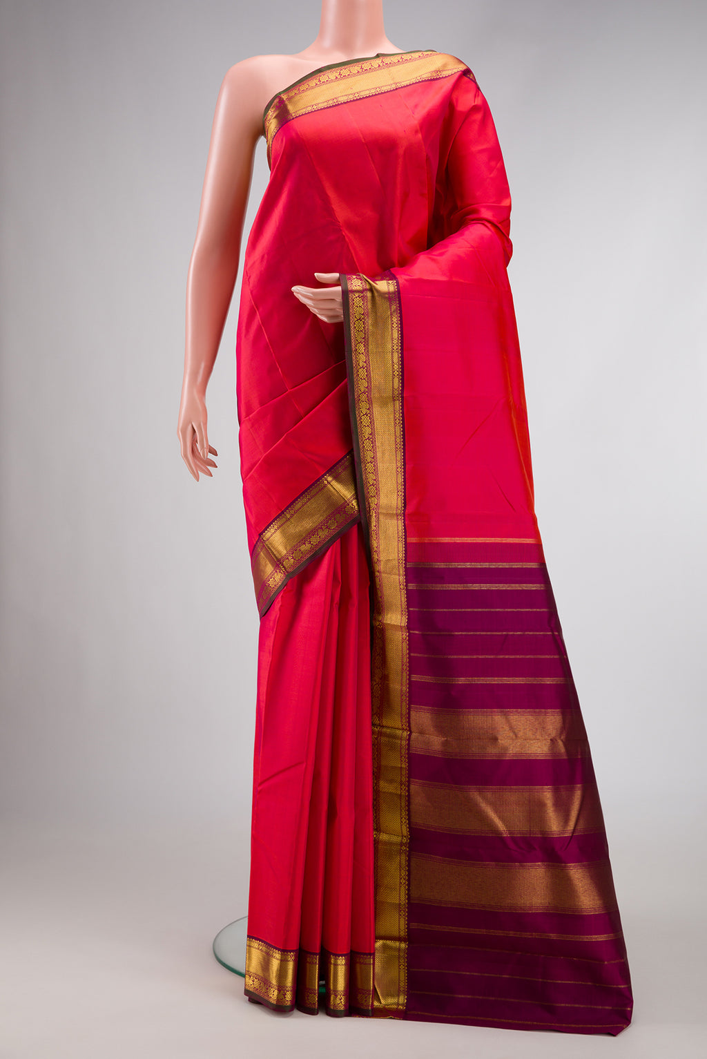Pure Silk Pure Zari Dark Pink Dual Tone Kanchipuram Saree with Plain Body and Zari Border.  displayed on a mannequin