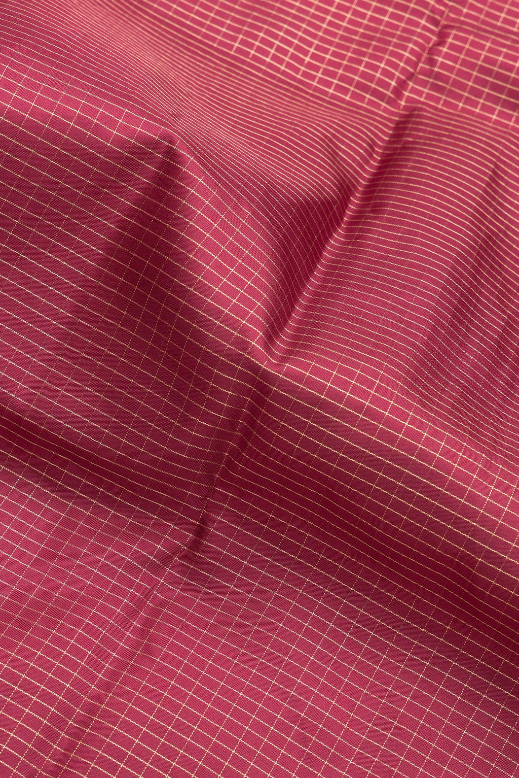Close up of Maroon Dual Tone Kanchipuram Silk Saree with Checked design on the body and Zari Border.  displaying folds