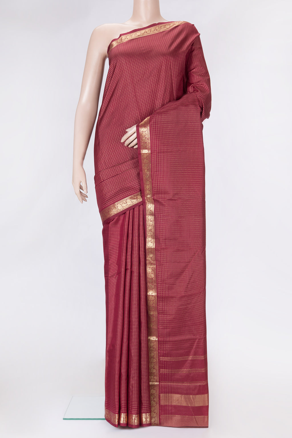 Maroon Dual Tone Kanchipuram Silk Saree with Checked design on the body and Zari Border.  displayed on a mannequin