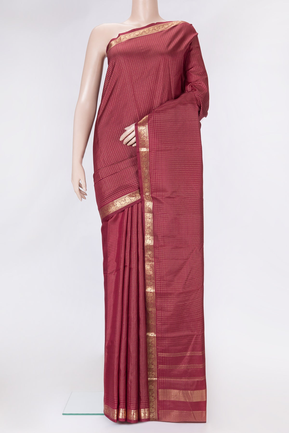 Maroon Dual Tone Kanchipuram Silk Saree with Checked design on the body and Zari Border.  displayed on a mannequin