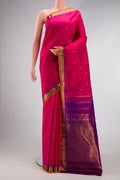 Pink Dual Tone Kanchipuram Silk Saree with Zari Butta on the body and Zari Border.  displayed on a mannequin