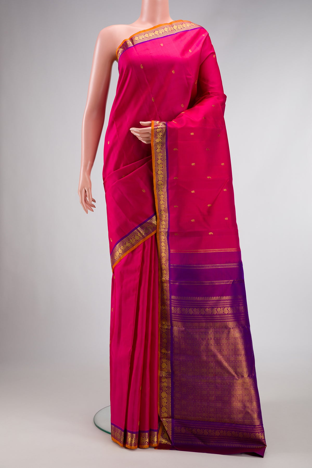 Pink Dual Tone Kanchipuram Silk Saree with Zari Butta on the body and Zari Border.  displayed on a mannequin