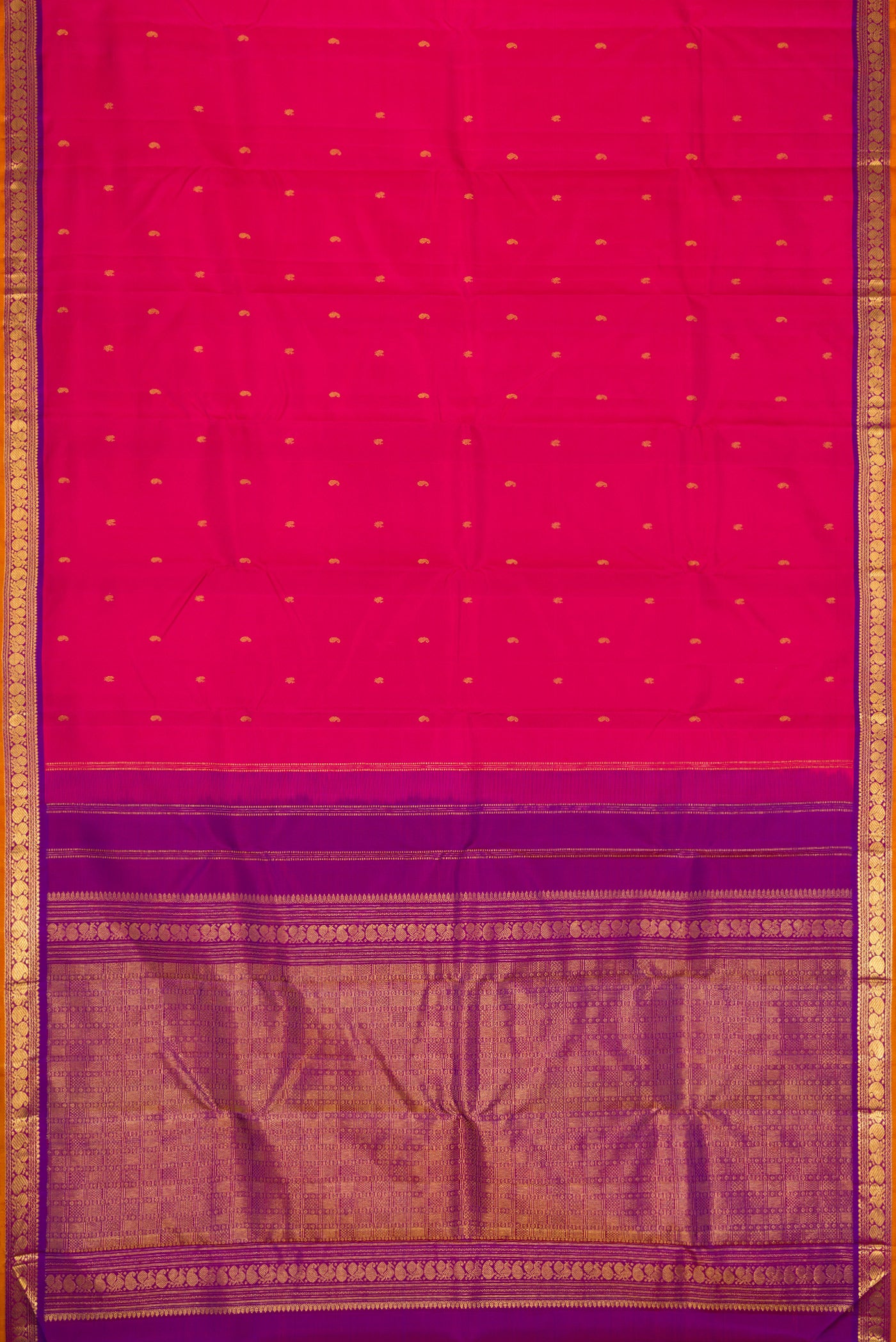 Flat view of Pink Dual Tone Kanchipuram Silk Saree with Zari Butta on the body and Zari Border. 