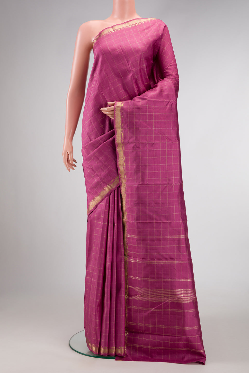 Pink Dual Tone Kanchipuram Silk Saree with Checked design on the body and Zari Border.  displayed on a mannequin