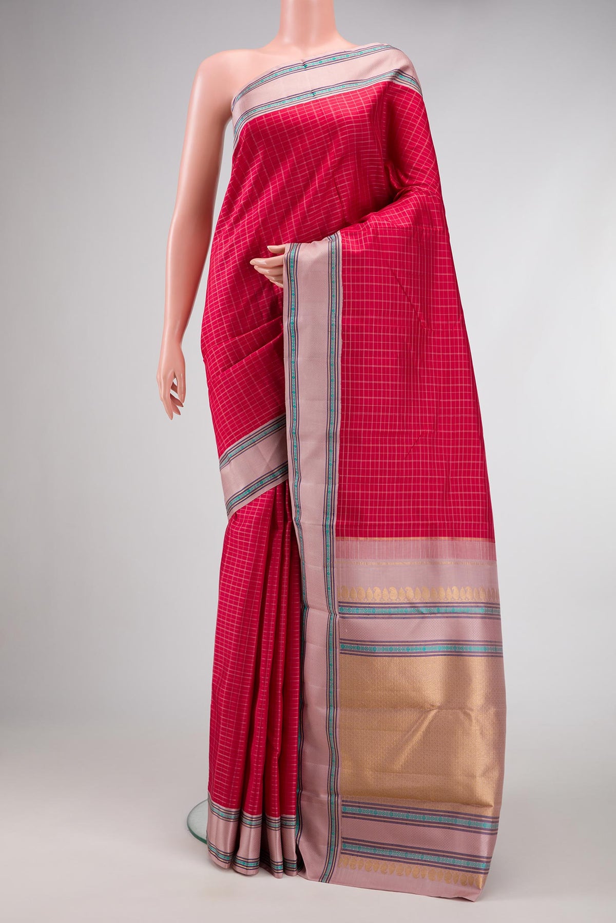 Pure Silk Pure Zari Maroon Dual Tone Kanjivaram Saree with Checked design on the body and Zari And Thread Border.  displayed on a mannequin