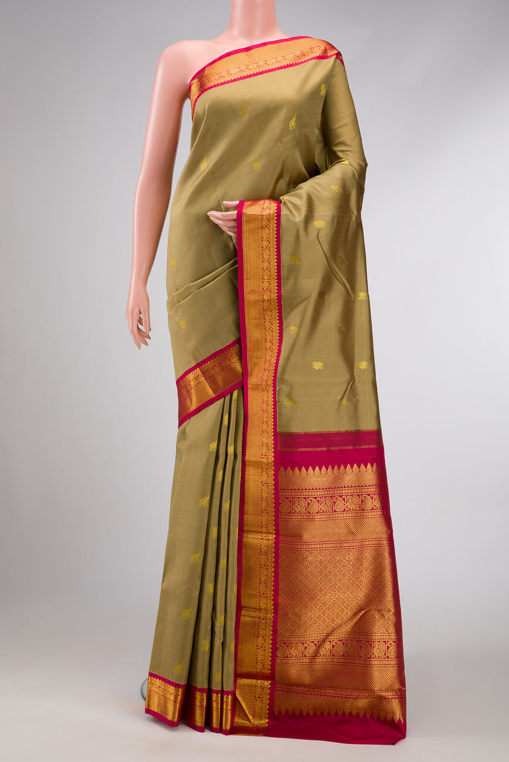 Dark Beige Dual Tone Kanjivaram Silk Saree with Zari Butta on the body and Zari Border.  displayed on a mannequin
