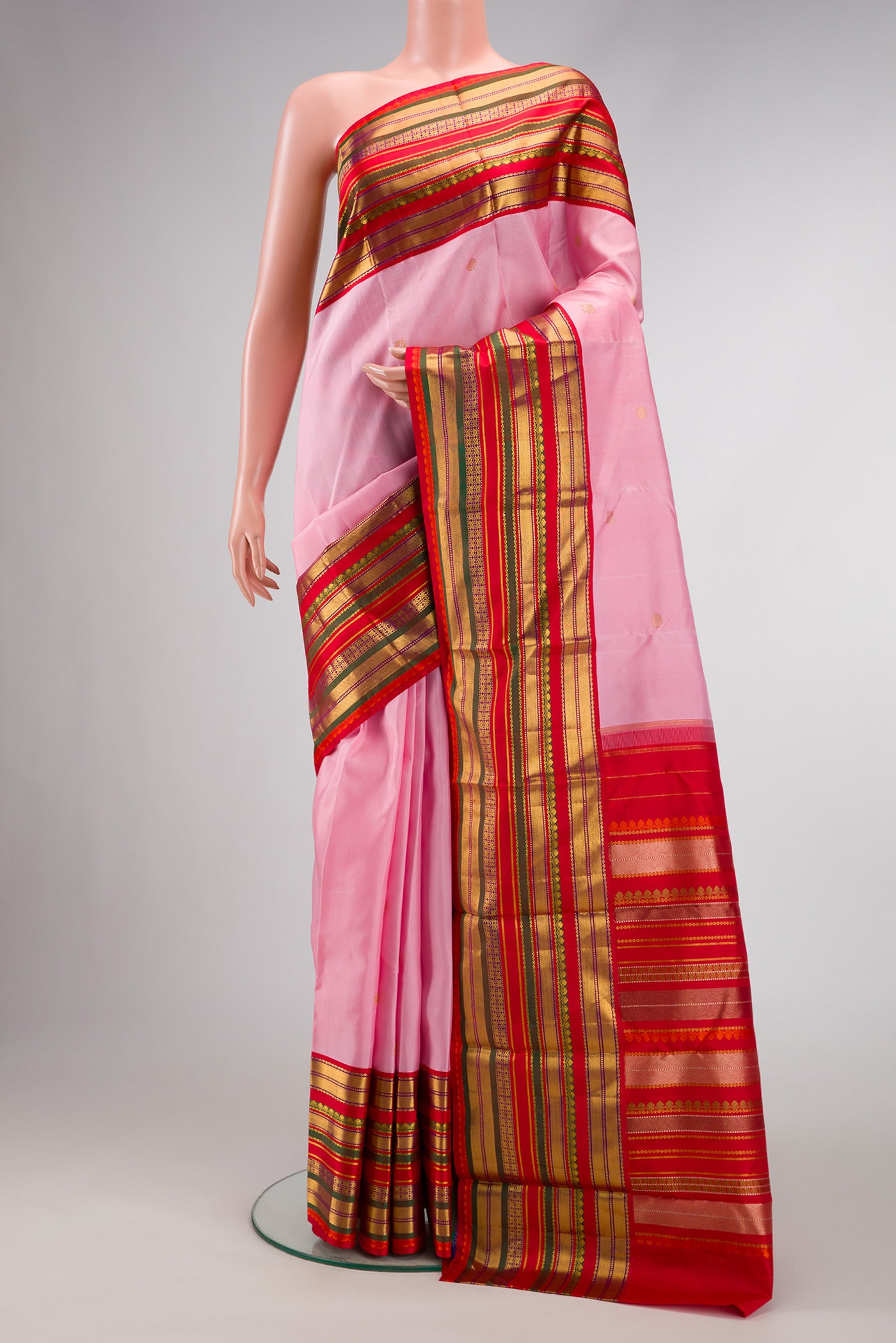 Pink Dual Tone Kanjivaram Silk Saree with Zari Butta on the body and Zari Border.  displayed on a mannequin