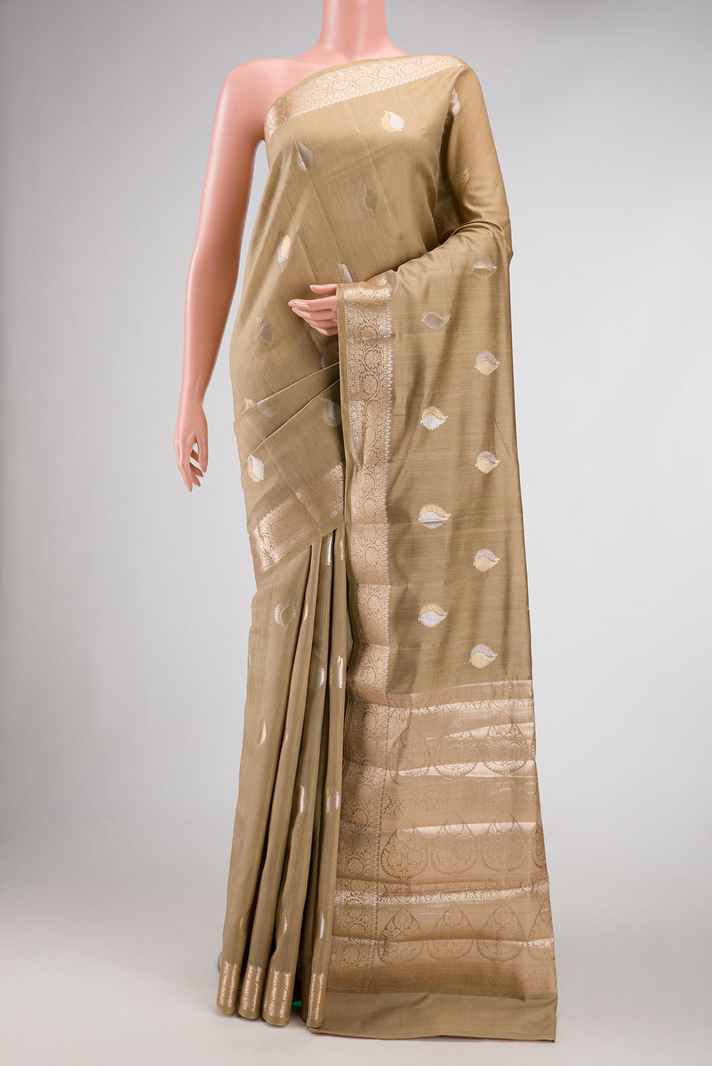 Dark Beige Dual Tone Tussar Silk Saree with Zari Brocade on the body and Zari Border.  displayed on a mannequin