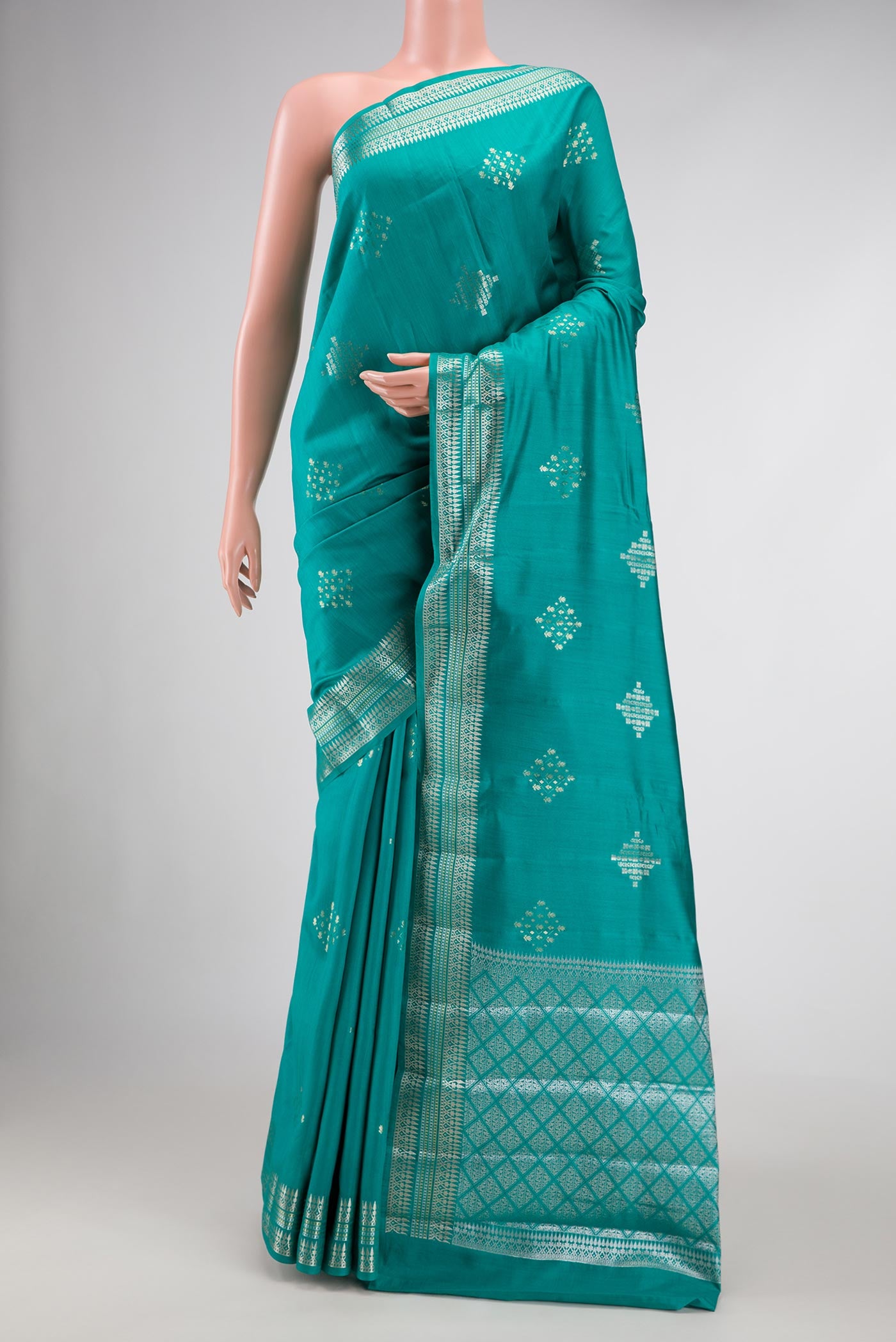 Sky Blue Dual Tone Tussar Silk Saree with Zari Brocade on the body and Zari Border.  displayed on a mannequin
