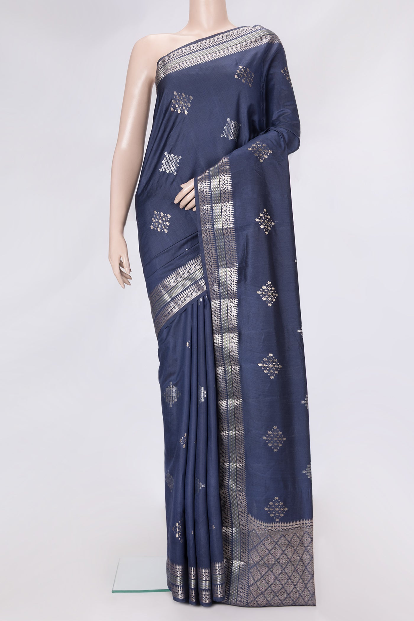 Navy Blue Dual Tone Tussar Silk Saree with Zari Butta on the body and Zari Border.  displayed on a mannequin