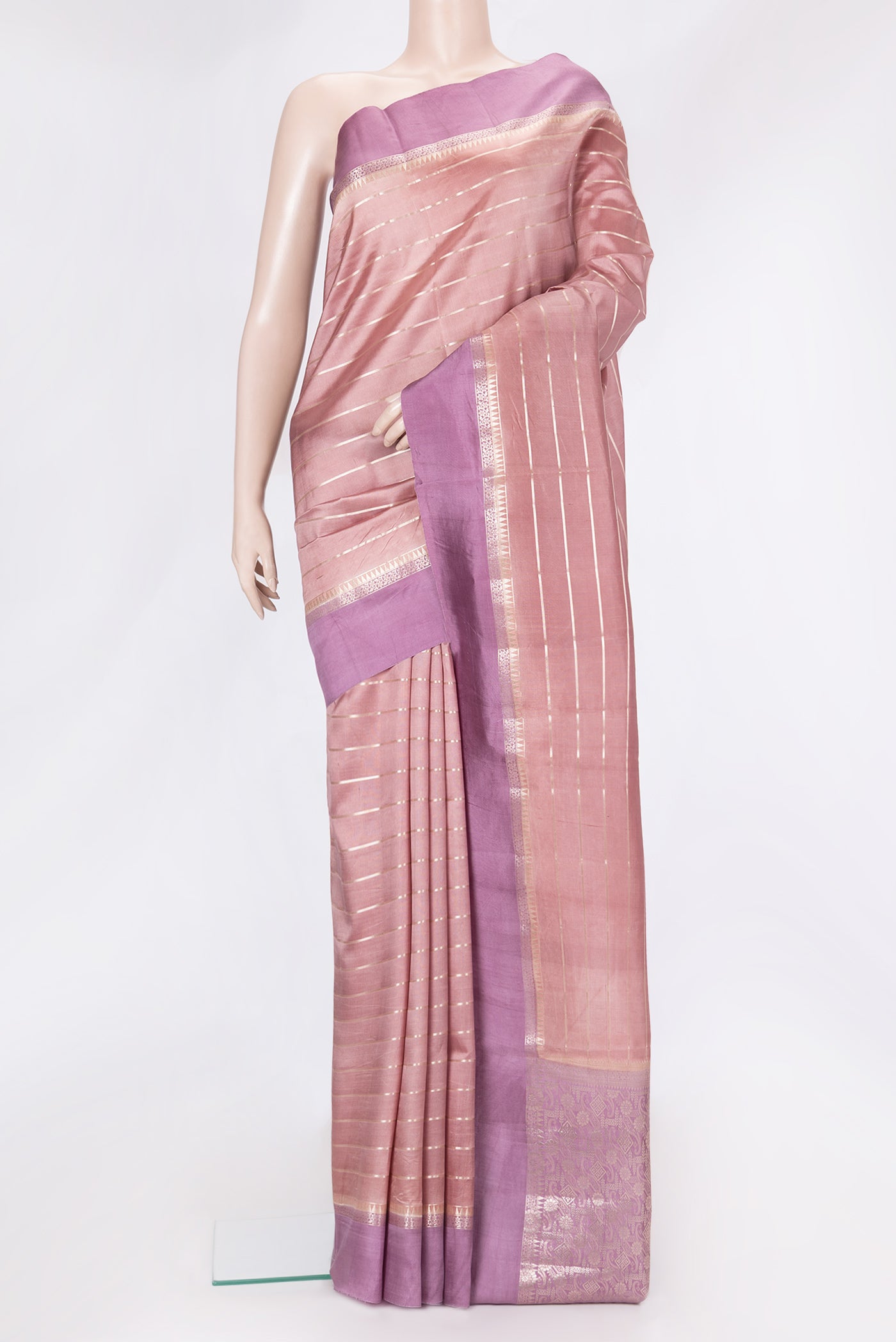 Rose Gold Dual Tone Tussar Silk Saree with Stripes on the body and Zari Border.  displayed on a mannequin