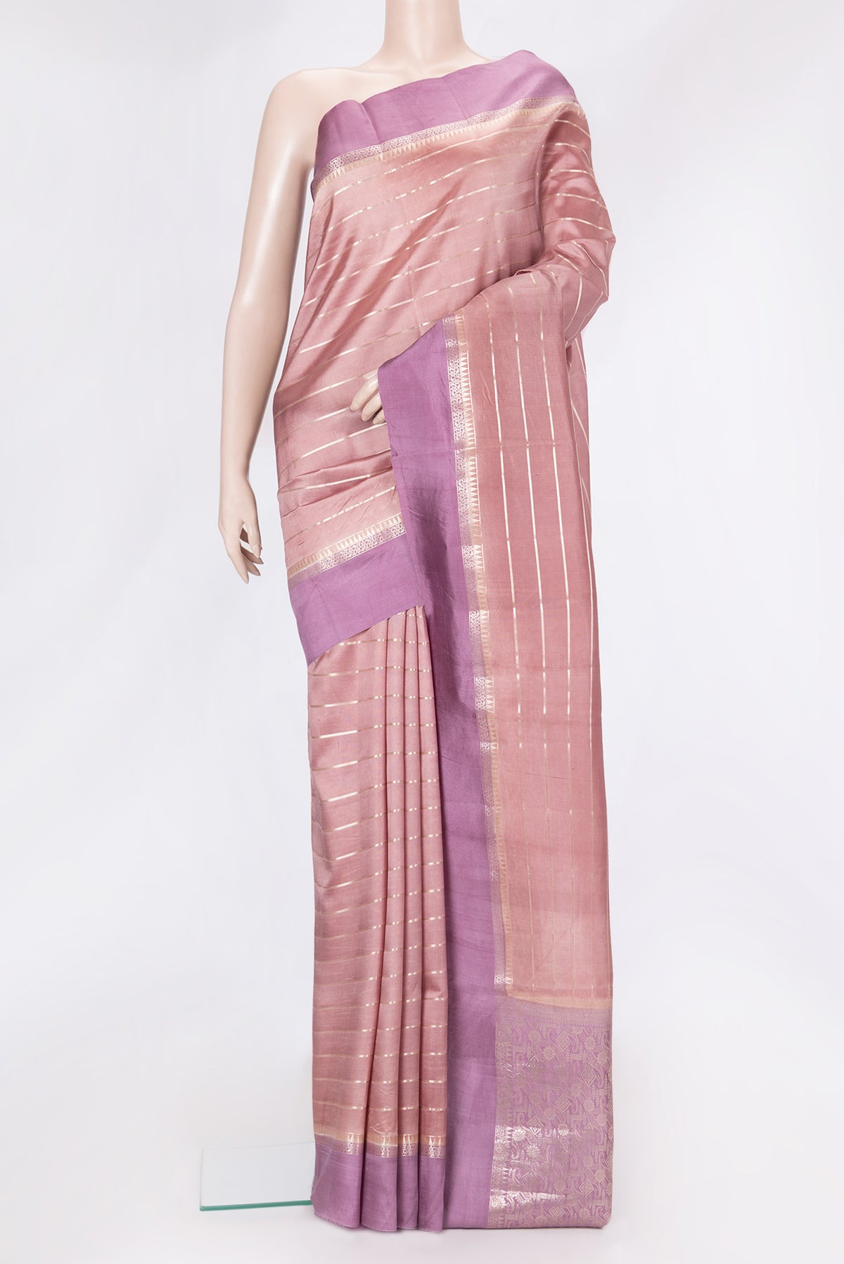Rose Gold Dual Tone Tussar Silk Saree with Stripes on the body and Zari Border.  displayed on a mannequin