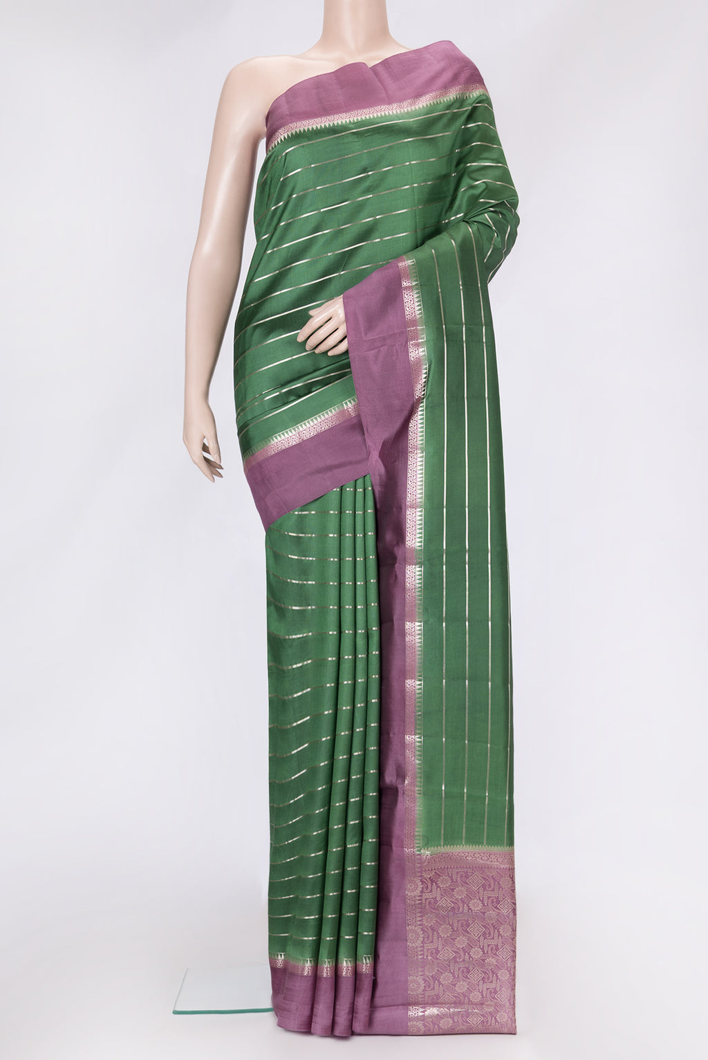 Green Dual Tone Tussar Silk Saree with Stripes on the body and Zari Border.  displayed on a mannequin