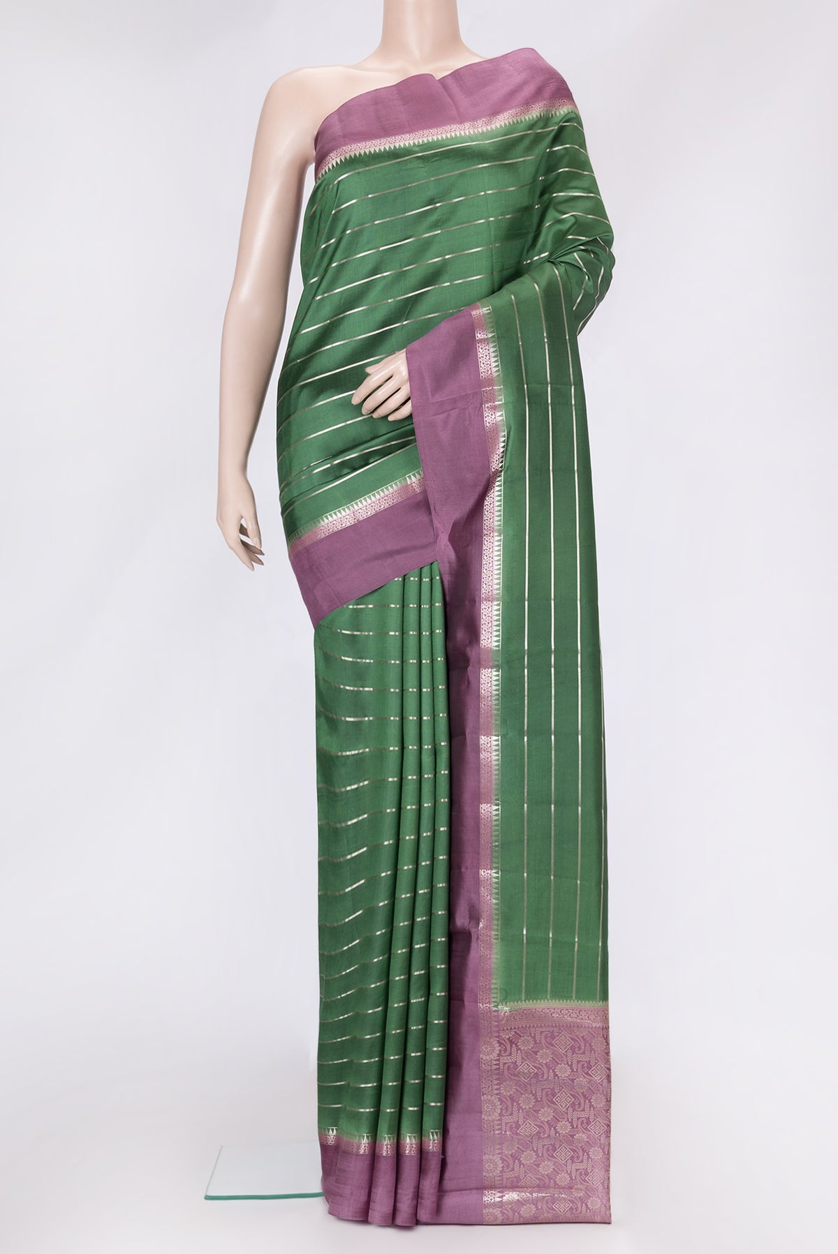 Green Dual Tone Tussar Silk Saree with Stripes on the body and Zari Border.  displayed on a mannequin