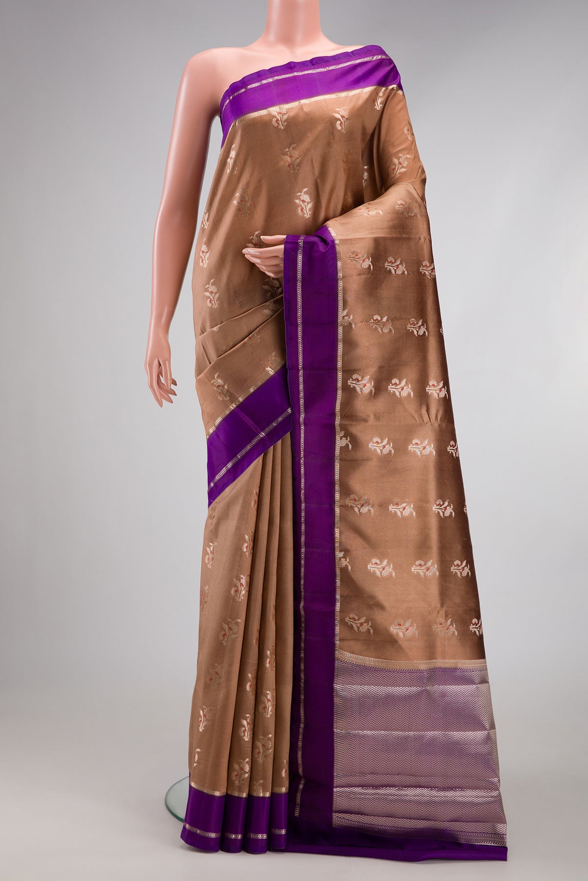 Brown Dual Tone Tussar Silk Saree with Zari Butta on the body and Zari Border.  displayed on a mannequin