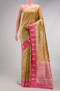 Gold Dual Tone Tussar Silk Saree with Zari Butta on the body and Fancy Border.  displayed on a mannequin