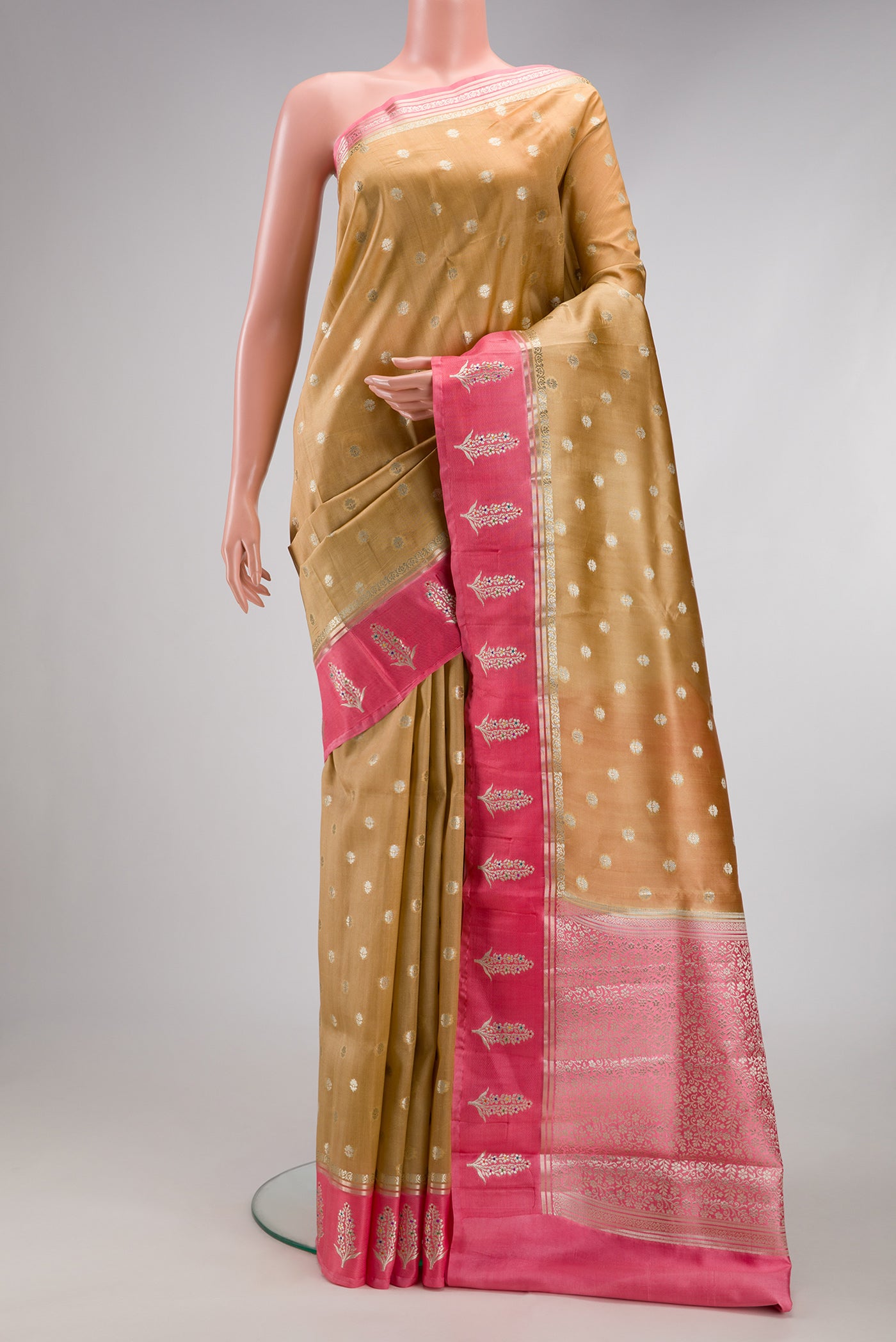 Gold Dual Tone Tussar Silk Saree with Zari Butta on the body and Fancy Border.  displayed on a mannequin