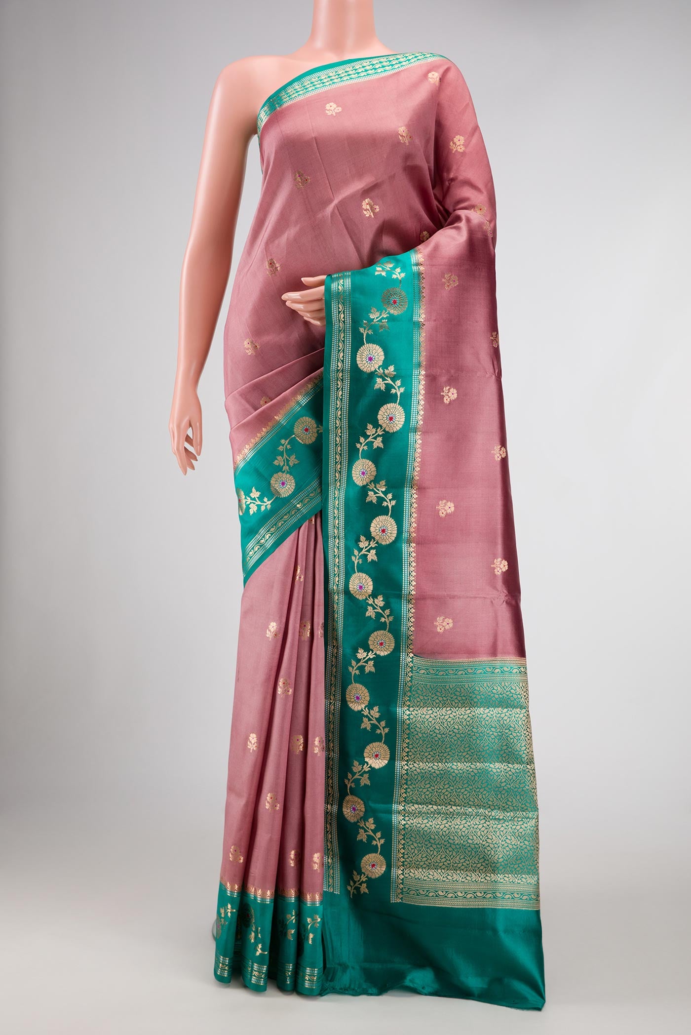 Rose Gold Dual Tone Tussar Silk Saree with Zari Butta on the body and Zari Border.  displayed on a mannequin